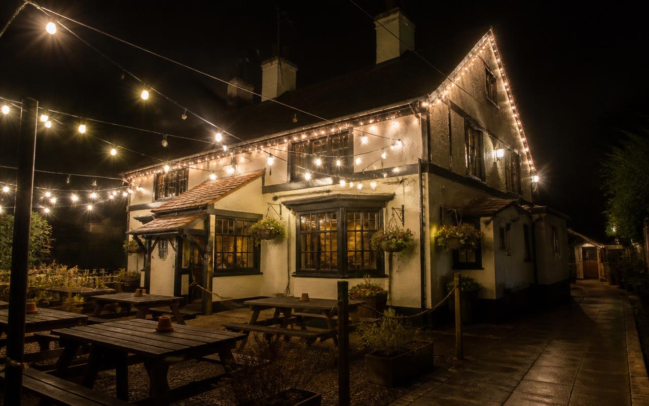 Pub Exterior — Commercial Install — London, lit with warm white Christmas lights